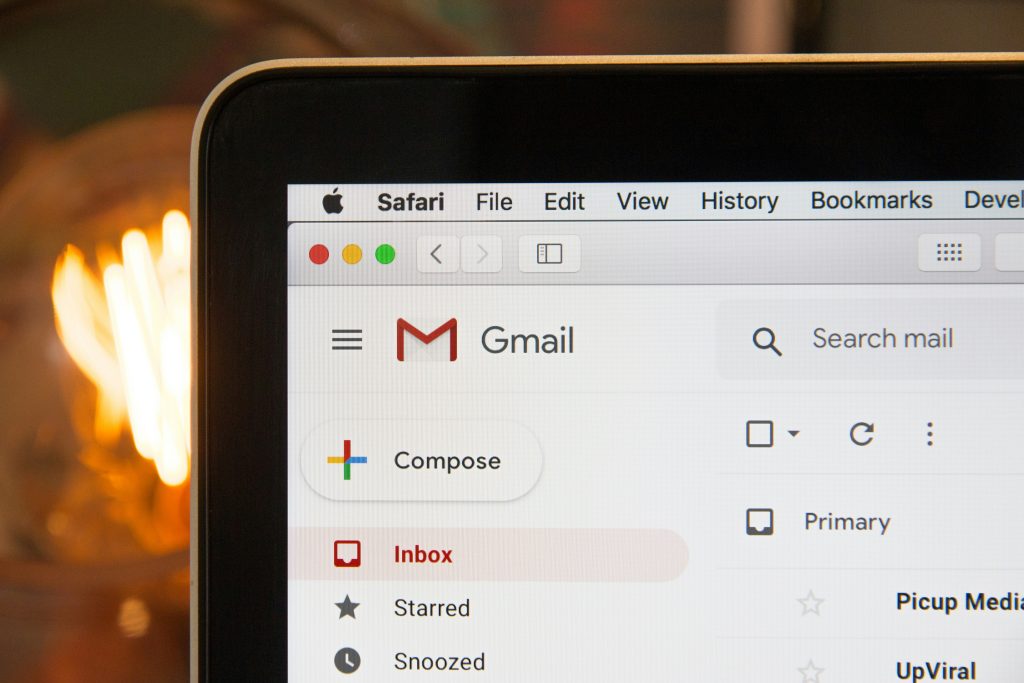 Gmail inbox interface displayed on a laptop screen, featuring email composition and organization tools, relevant to email automation in digital marketing.