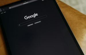 Tablet displaying Google search interface, emphasizing digital marketing and SEO strategies.